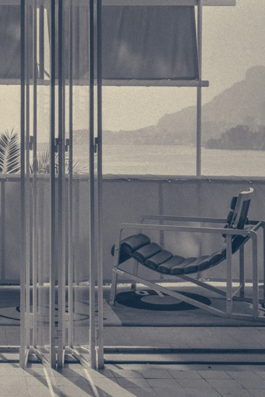 Interior of Villa E-1027 designed by Eileen Gray, Roquebrune-Cap-Martin, showing terrace with chaise and Mediterranean view, circa 1929