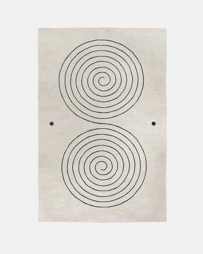 Fitzroy rug, Edition 03: two navy spirals on a sparse cream ground, hand-knotted in New Zealand wool and bamboo silk