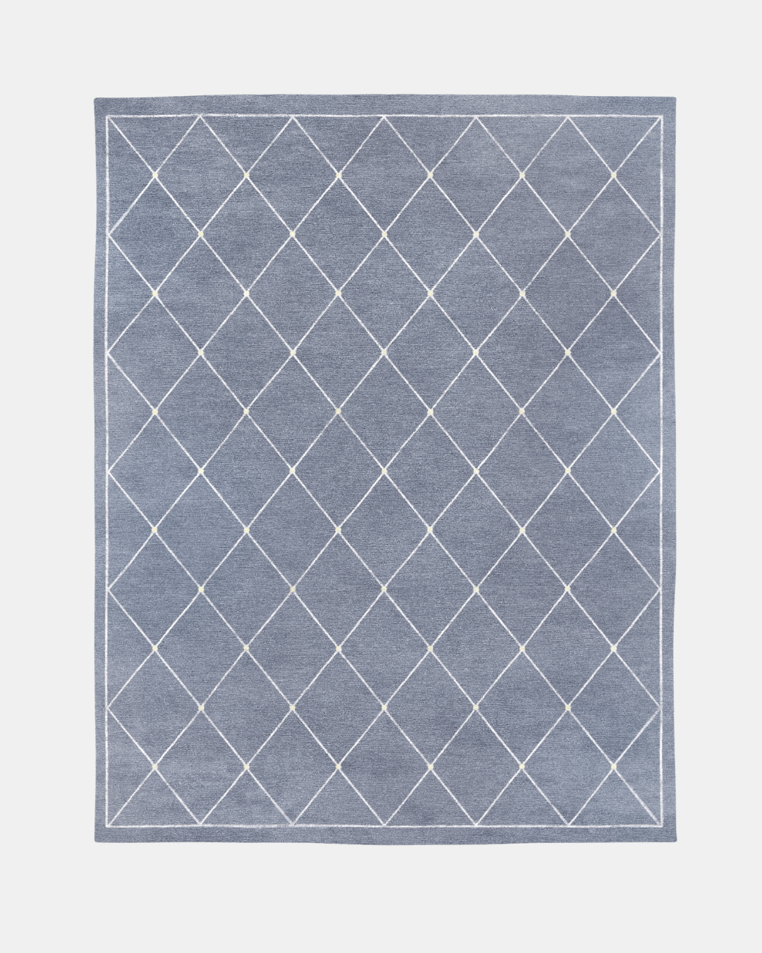 Serge rug, Edition 03: white diamond lattice with pale gold knots on a blue-grey ground, hand-knotted in wool and bamboo silk